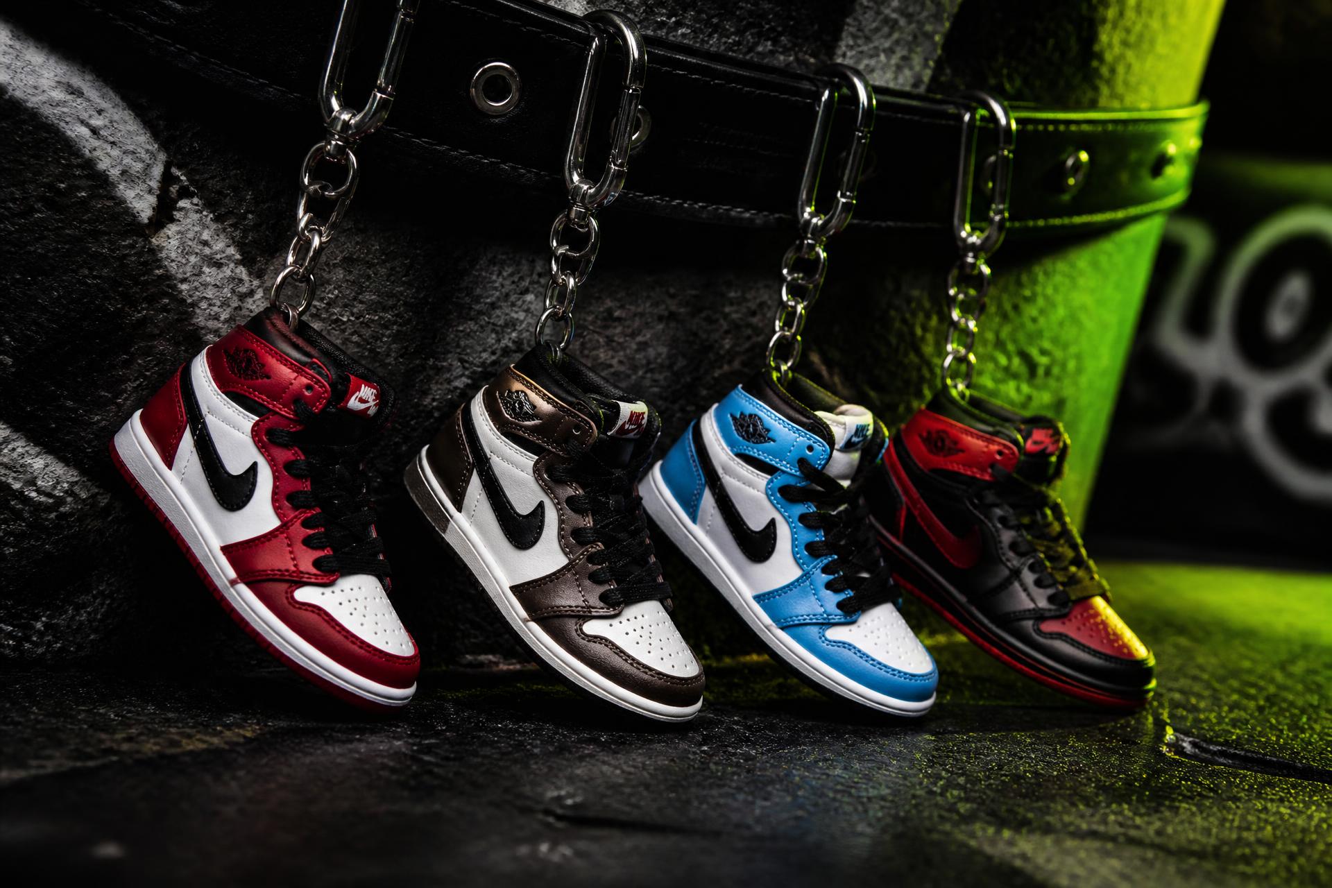 Bakost mini Jordan 1 sneaker keychains on black concrete